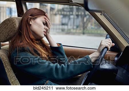 Frustrated Caucasian woman driving car View Large Photo Image Stock Image - Frustrated Caucasian woman driving car. Fotosearch