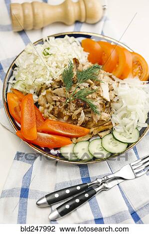 Stock Image - Garnish on meat and vegetable plate. Fotosearch