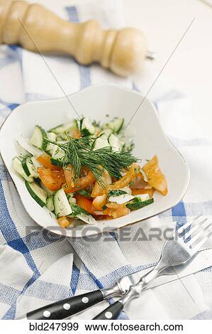 Stock Photo - Garnish on salad in bowl. Fotosearch