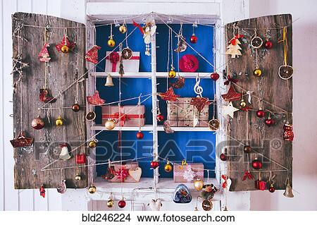 Gift boxes on wooden shelves near ornaments View Large Photo Image Picture - Gift boxes on wooden shelves near ornaments. Fotosearch