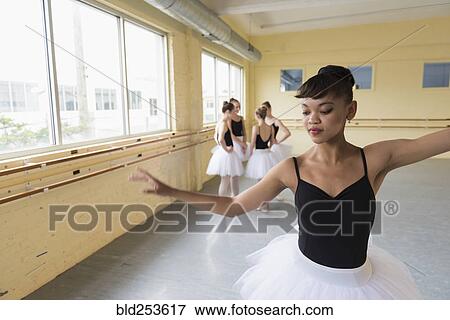 Stock Photo - Girl practicing in ballet studio. Fotosearch