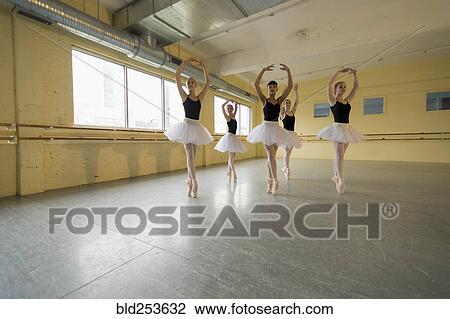 Stock Image - Girls dancing in ballet studio. Fotosearch
