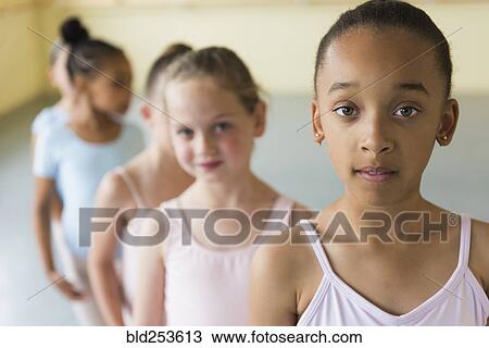 Girls standing in a row in ballet studio View Large Photo Image Stock Image - Girls standing in a row in ballet studio. Fotosearch