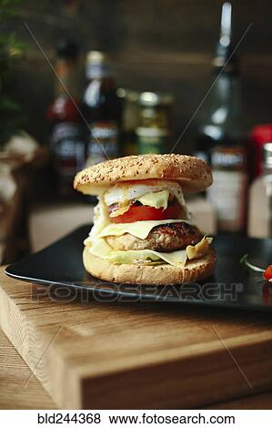 Stock Photo - Gourmet cheeseburger on plate. Fotosearch