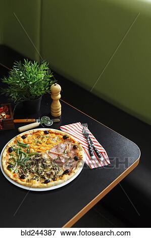 Gourmet pizza on plate View Large Photo Image Stock Photo - Gourmet pizza on plate. Fotosearch