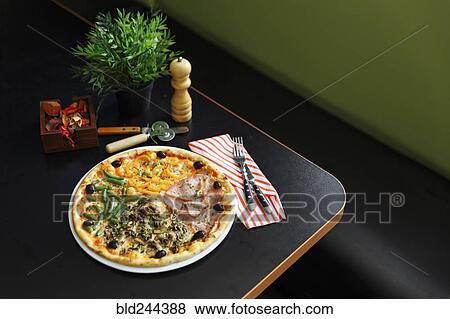 Gourmet pizza on plate View Large Photo Image Stock Photo - Gourmet pizza on plate. Fotosearch
