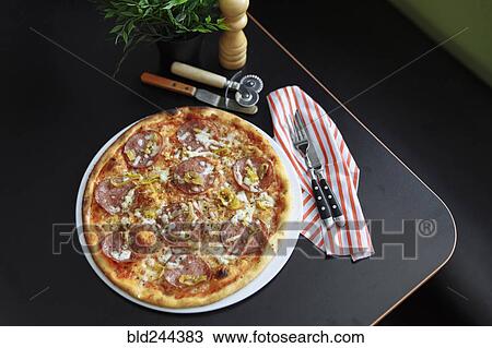 Stock Image - Gourmet pizza with pepperoni. Fotosearch