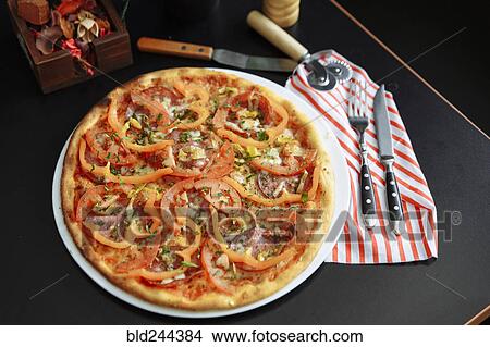 Gourmet pizza with peppers View Large Photo Image Picture - Gourmet pizza with peppers. Fotosearch