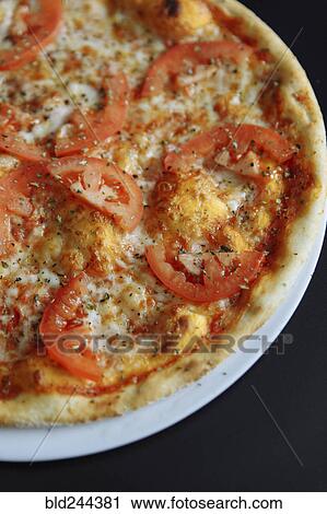 Gourmet pizza with tomatoes View Large Photo Image Stock Image - Gourmet pizza with tomatoes. Fotosearch