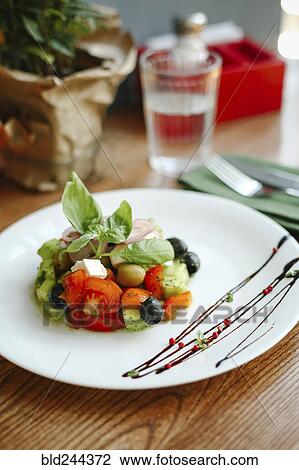 Gourmet salad on plate with sauce View Large Photo Image Stock Image - Gourmet salad on plate with sauce. Fotosearch