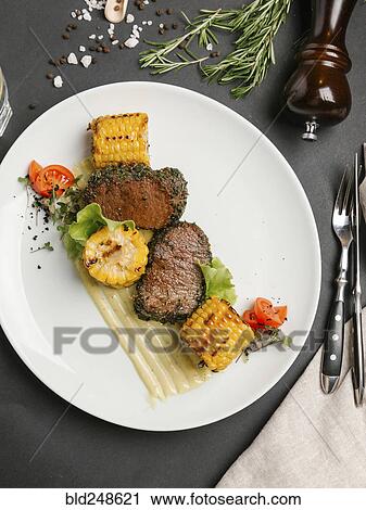 Grilled beef and corn on plate View Large Photo Image Stock Image - Grilled beef and corn on plate. Fotosearch