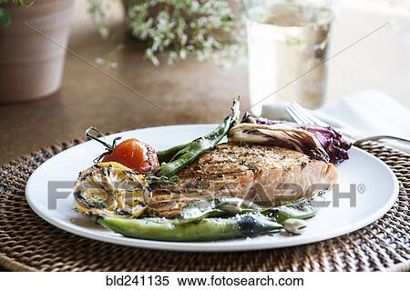 Stock Photography - "Grilled salmon with tomato, lemon and green beans". Fotosearch