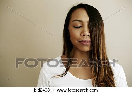 Hair of Asian woman covering half of face View Large Photo Image Stock Photo - Hair of Asian woman covering half of face. Fotosearch