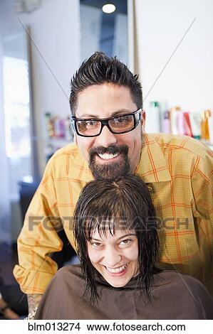 Picture - Hairdresser and client in salon. Fotosearch