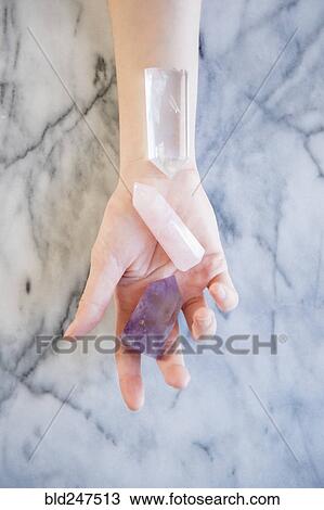 Hand of Caucasian woman holding crystals View Large Photo Image Stock Image - Hand of Caucasian woman holding crystals. Fotosearch