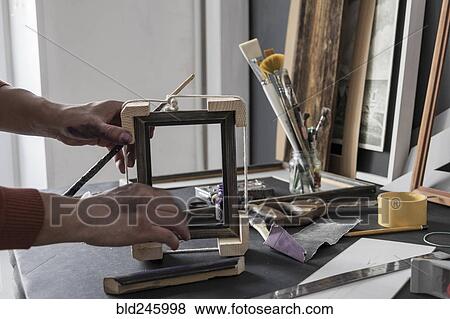 Hands of Caucasian artist making picture frame View Large Photo Image Stock Photo - Hands of Caucasian artist making picture frame. Fotosearch