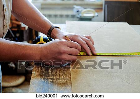 Hands of Caucasian man using pencil and measuring tape View Large Photo Image Stock Image - Hands of Caucasian man using pencil and measuring tape. Fotosearch