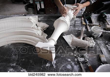 Hands of Caucasian sculptor carving plaster piece View Large Photo Image Stock Image - Hands of Caucasian sculptor carving plaster piece. Fotosearch