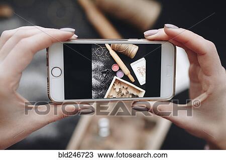 Hands of Caucasian woman photographing baking supplies View Large Photo Image Stock Image - Hands of Caucasian woman photographing baking supplies. Fotosearch