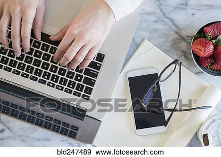 Hands of Caucasian woman typing on laptop View Large Photo Image Stock Photo - Hands of Caucasian woman typing on laptop. Fotosearch