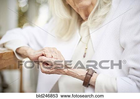 Stock Image - Hands of older Caucasian woman. Fotosearch