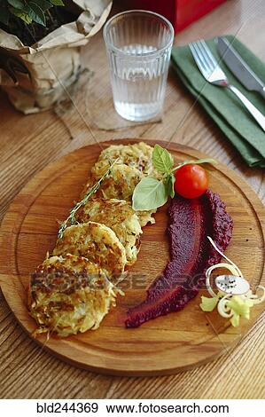 Hash browns and sauce on wooden tray View Large Photo Image Stock Photo - Hash browns and sauce on wooden tray. Fotosearch