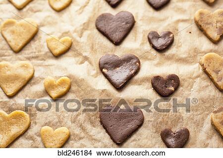 Picture - Heart-shape cookies on baking sheet. Fotosearch