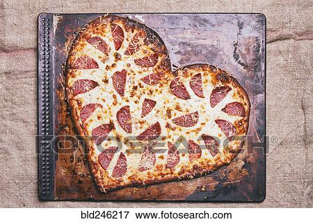 Heart-shaped pizza on pan View Large Photo Image Stock Photo - Heart-shaped pizza on pan. Fotosearch