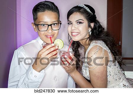 Hispanic boy and girl drinking beverages with straws View Large Photo Image Stock Image - Hispanic boy and girl drinking beverages with straws. Fotosearch