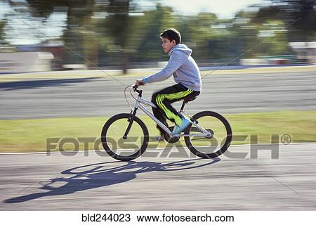 boy riding bicycle