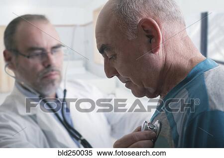 Hispanic doctor examining patient with stethoscope View Large Photo Image Stock Photography - Hispanic doctor examining patient with stethoscope. Fotosearch