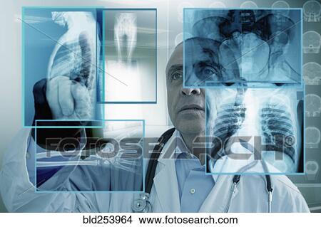 Hispanic doctor using virtual computer screen View Large Photo Image Picture - Hispanic doctor using virtual computer screen. Fotosearch
