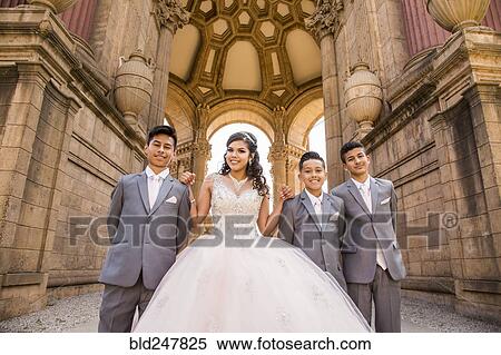 Stock Photography - Hispanic girl posing with boys. Fotosearch
