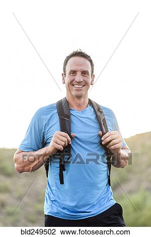 Hispanic hiker wearing backpack View Large Photo Image Stock Image - Hispanic hiker wearing backpack. Fotosearch