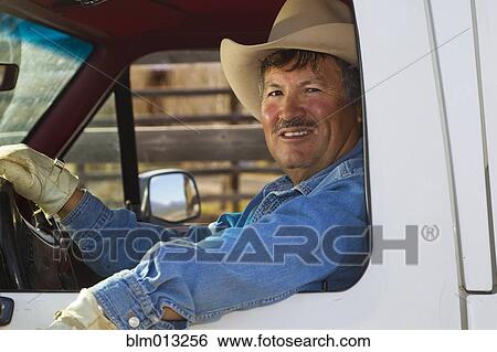 Hispanic man driving truck View Large Photo Image Stock Photograph - Hispanic man driving truck. Fotosearch