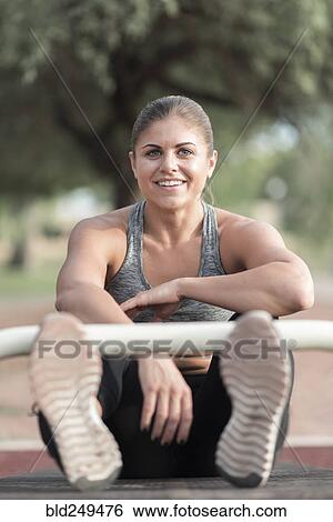 Hispanic woman resting outdoors View Large Photo Image Stock Photograph - Hispanic woman resting outdoors. Fotosearch