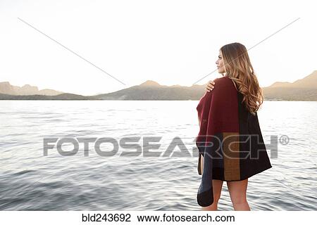 Hispanic woman standing at river View Large Photo Image Stock Image - Hispanic woman standing at river. Fotosearch