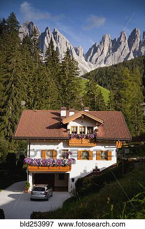 Stock Photo - House in remote mountain landscape, Funes, Trentino Alto Adige, Italy. Fotosearch