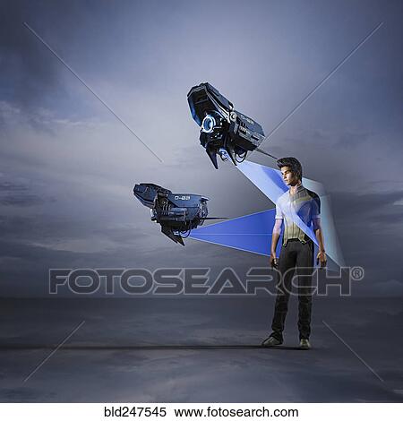 Stock Photography - Hovering drones scanning man. Fotosearch