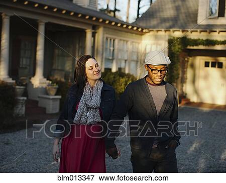 Husband holding pregnant wife's hand View Large Photo Image Stock Photo - Husband holding pregnant wife's hand. Fotosearch