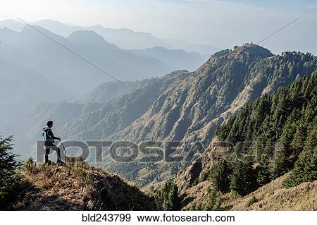 Indian man hiking on mountain View Large Photo Image Stock Photo - Indian man hiking on mountain. Fotosearch