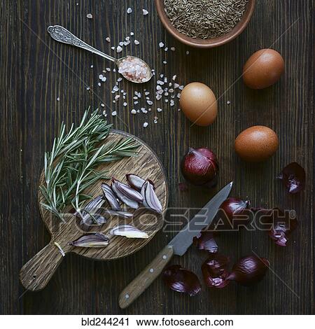 Stock Image - Ingredients on wooden table. Fotosearch