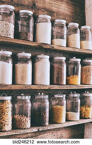 Jars of ingredients on wooden shelves View Large Photo Image Stock Image - Jars of ingredients on wooden shelves. Fotosearch