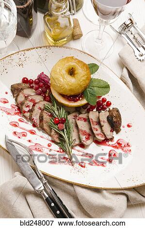 Kiln duck with apples View Large Photo Image Stock Photo - Kiln duck with apples. Fotosearch