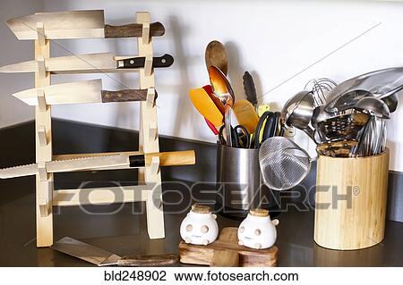 Knives in rack near kitchen utensils View Large Photo Image Stock Image - Knives in rack near kitchen utensils. Fotosearch