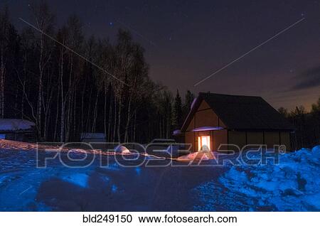 Light glowing in remote cabin in winter View Large Photo Image Stock Image - Light glowing in remote cabin in winter. Fotosearch