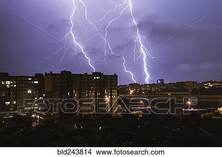 Picture - Lightning striking city at night. Fotosearch