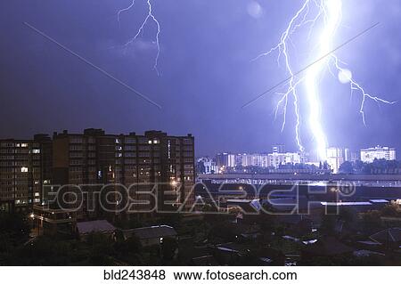 Stock Photo - Lightning striking city at night. Fotosearch