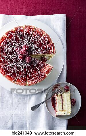 Stock Photo - Limoncello raspberry cake on plate and tray. Fotosearch