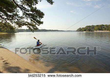 Man kayaking in lake View Large Photo Image Stock Photography - Man kayaking in lake. Fotosearch